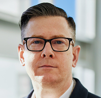 Alexander Hughes, CEO und Führungskraft eines Krypto-Trading-Unternehmens, Porträt